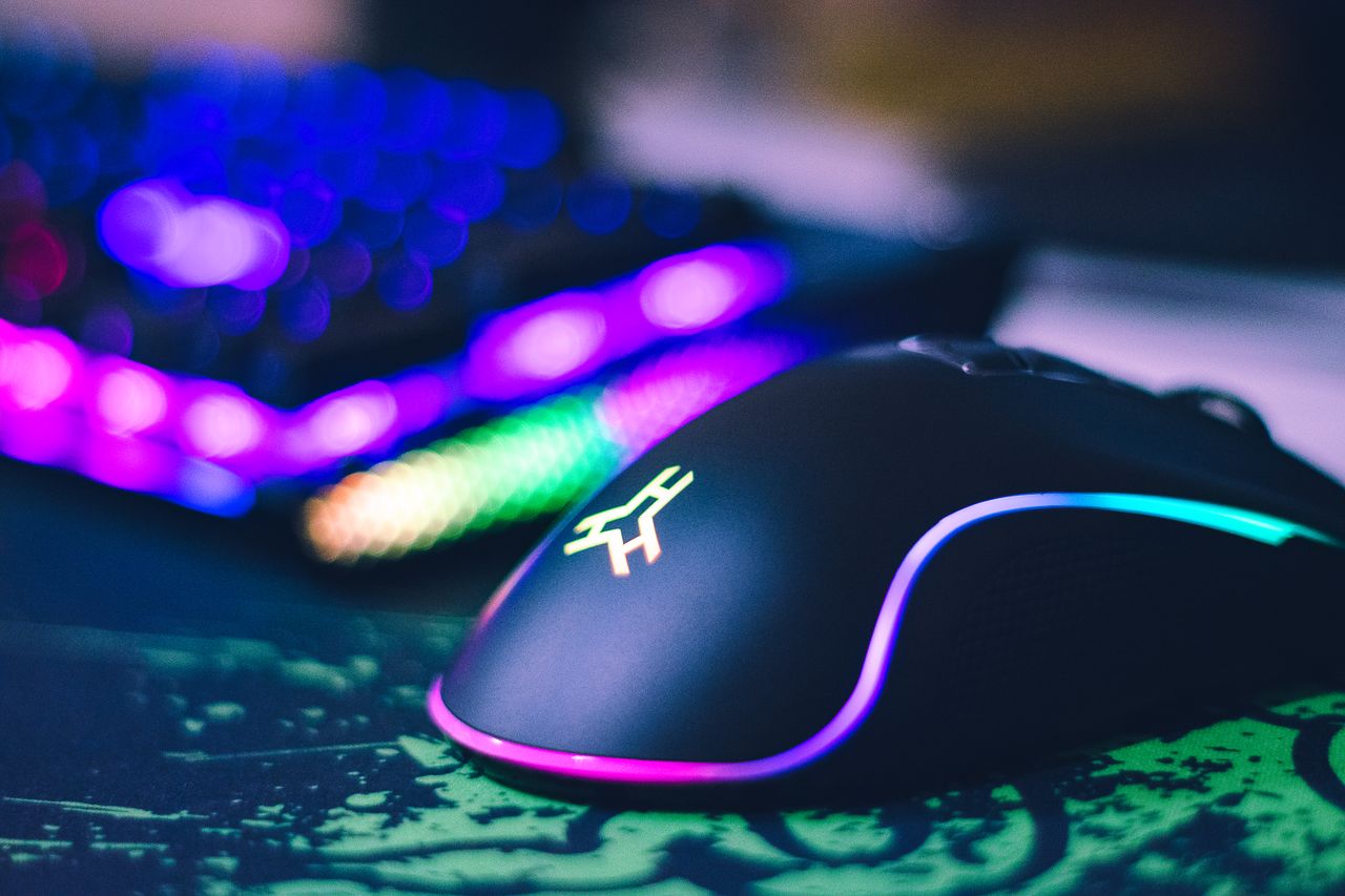 social-feed-img-02 A close-up of a colorful gaming mouse and illuminated RGB keyboard, perfect for tech setups.