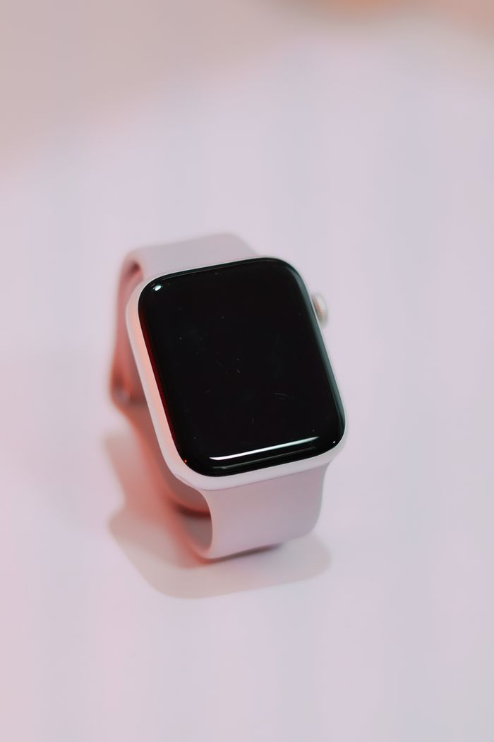 social-feed-img-04 A sleek white smartwatch displayed on a plain surface with a minimalist style.